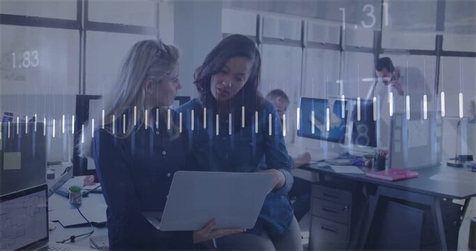 Two women working over laptop in business office, waveform appearing and orange chart guiding plans