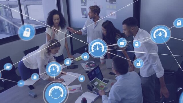 Business team clustering around charts, seated man scrolling tablet generating blue network overlay