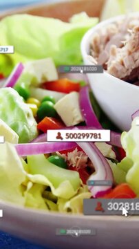 Vertical video: Pointer hovering over salad bowl, user tags appearing, clustering for food tagging
