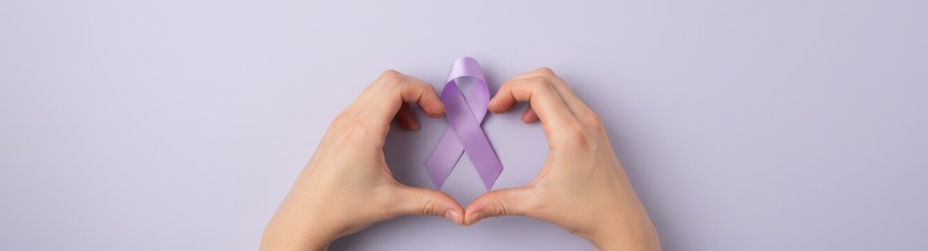 Woman hands forming heart shape around Periwinkle ribbon on pastel background. Esophageal Cancer Awareness Month, Stomach cancer, Pulmonary hypertension. Medical support for chronic illness patients