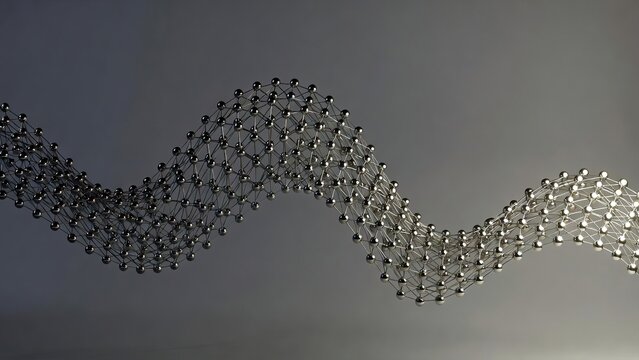 Molecular structure of graphene sheet, carbon atom lattice wave on gray background, nanotechnology and science research concept