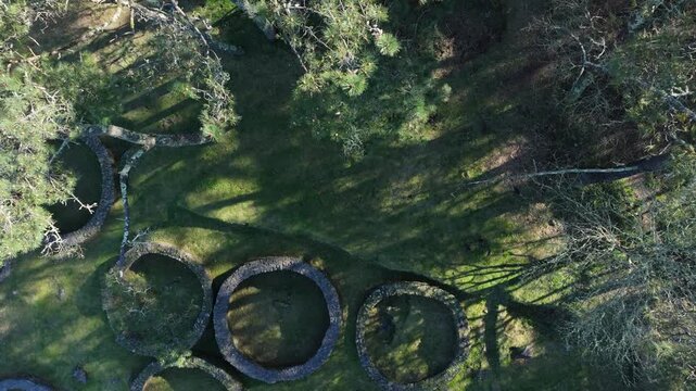 Circular Stone Foundations At Castro de Borneiro - Iron Age Fortified Settlement In Galicia, Spain. aerial topdown shot