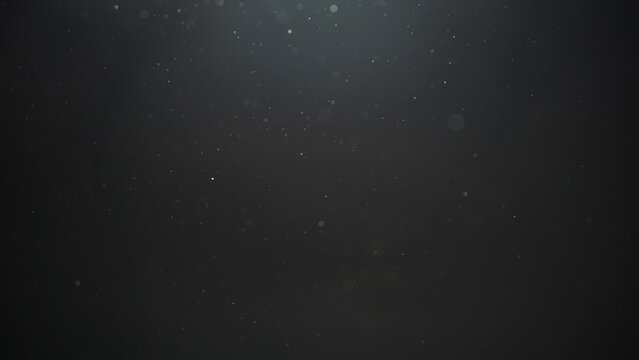 Real dust particles floating in air over dark background