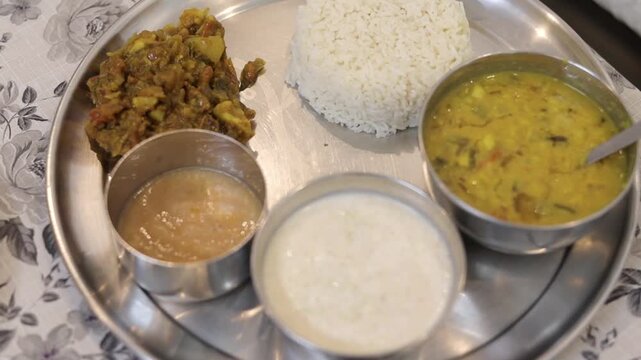 Indian thali with dal rice curd and chutney
