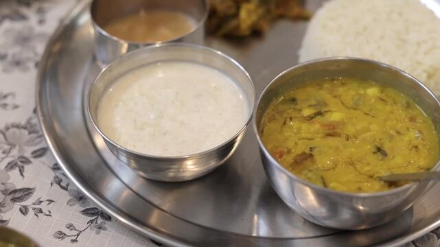 Indian thali with dal rice curd and chutney