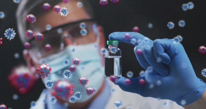 Animation of virus cells over caucasian male doctor holding vial
