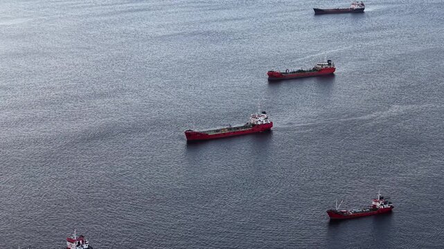 Aerial view of giant cargo ships and ocean-going transport fleets on the sea.