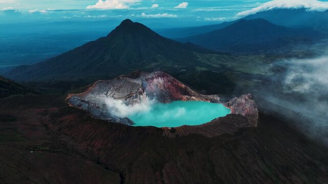 Cinematic aerial drone footage of Mount Ijen featuring its dramatic crater, turquoise sulfur lake, and volcanic landscape.