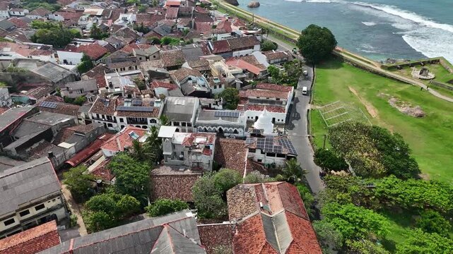 Drone flight over the red-tiled roofs and narrow streets of the old Galle Fort in Sri Lanka.