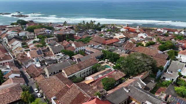 High angle drone view of the narrow streets and colonial houses within the walls of Galle Fort, Sri Lanka.