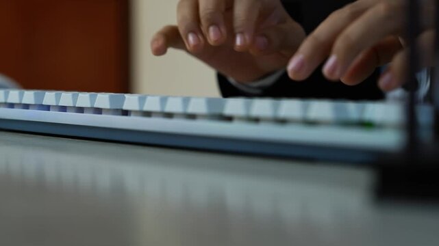 Hands typing on white mechanical keyboard, Close-up of hands typing on a white mechanical keyboard, shallow depth of field