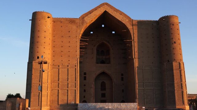 Scenic early morning sunrise view of the main facade of the historical Mausoleum of Khoja Ahmed Yasawi (Қожа Ахмет Ясауи) (from bottom the top), Turkestan, Kazakhstan