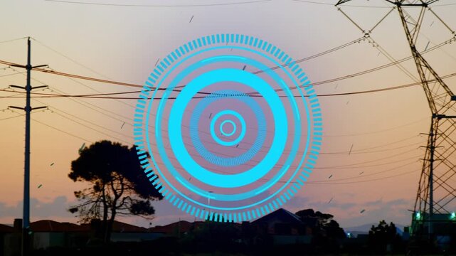 Animation of processing circle over electricity poles at sunset