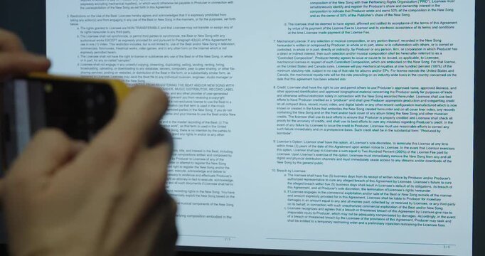 Close-up of a man secretly taking photos of confidential documents. Concept of data theft and security risk.