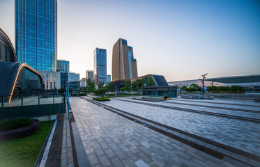Fototapeta premium Vibrant Urban Cityscape at Sunset with Modern Architecture and Serenity