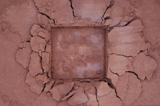 Chocolate cocoa or coffee powder background with broken square copy space