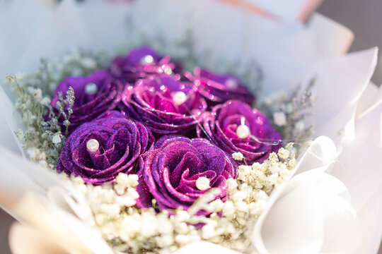 Luxury purple glitter rose bouquet with pearls and white gypsophila