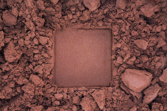 Chocolate cocoa or coffee powder background with square copy space