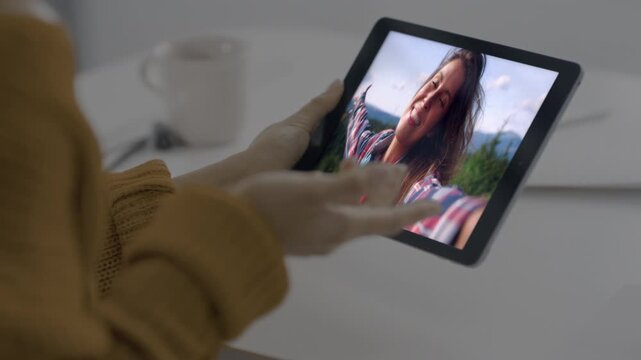 Tablet girl talking screen at trip closeup. Lady holding pad videocalling online
