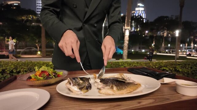 Luxury Dining in Dubai Tableside Fish Filleting Service at a High-End Restaurant Overlooking the Iconic Burj Khalifa and City Lights