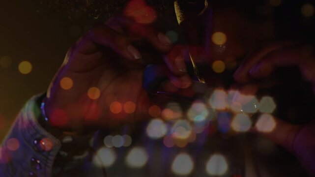 Animation of dancing crowd with white and blue bokeh light spots