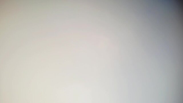 Cinematic timelapse of fluffy white clouds moving across a clear blue sky. Beautiful horizontal shot of bright, clean, and sunny atmosphere during a peaceful day. This footage captures the natural.