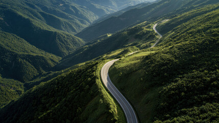 Winding road through green mountains