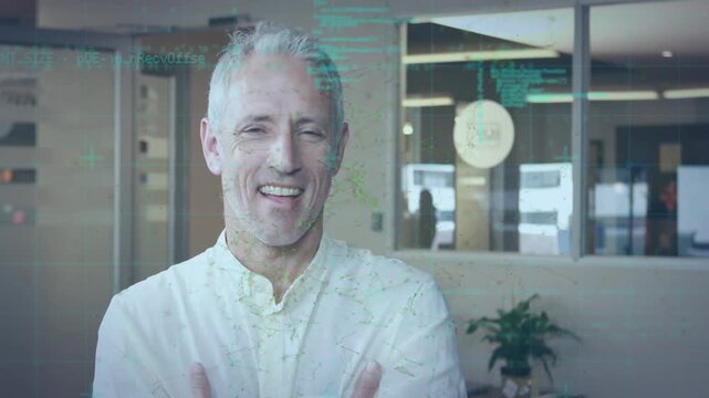 Animation of programming language over smiling caucasian man showing thumbs up in office