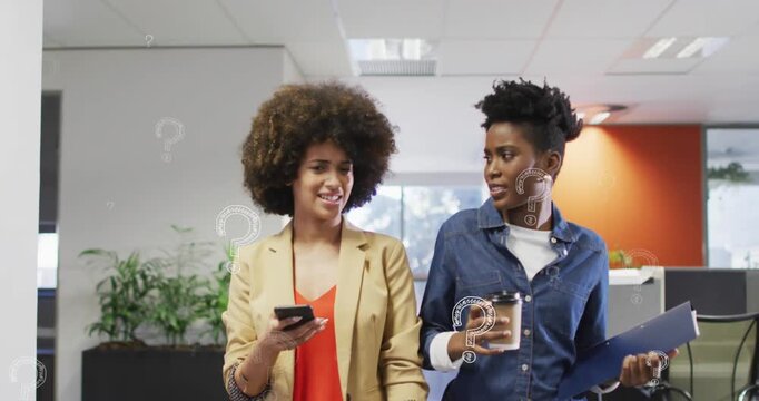 Animation of question marks over diverse business people working at office