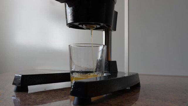 Freshly Squeezed Orange Juice Pouring Into Glass