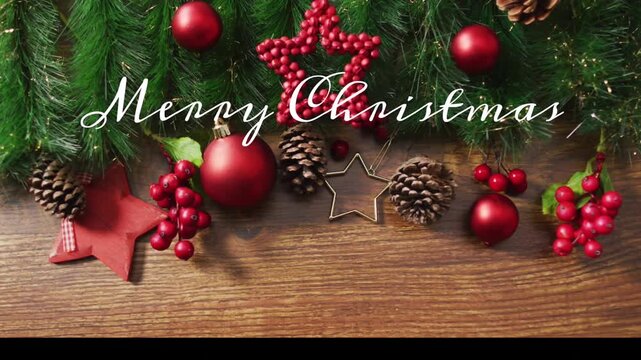 Merry Christmas text over festive decorations with pinecones and red ornaments