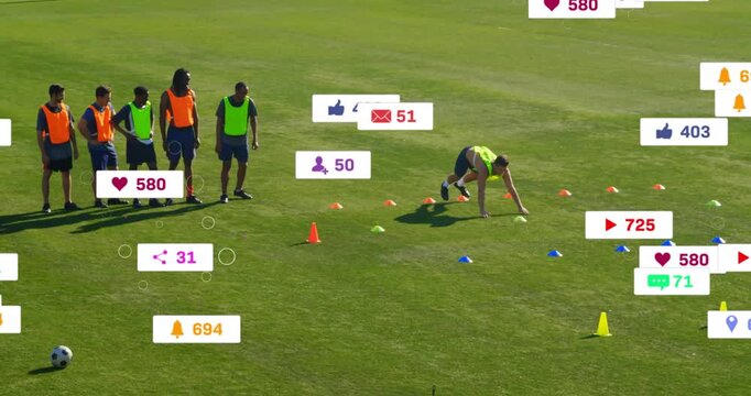 Training on field, soccer players with animation of social media interaction icons