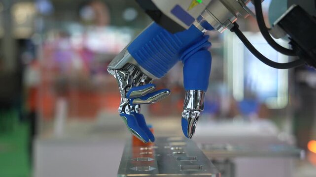 Artificial robotic hand at the presentation of robotics.Creation of artificial intelligence