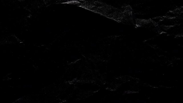 Stop-Motion Crumpled Black Paper Texture. Stop-motion animation quick successive changes of wrinkled paper osurfaces, creating dynamic textured transitions with visible creases.
