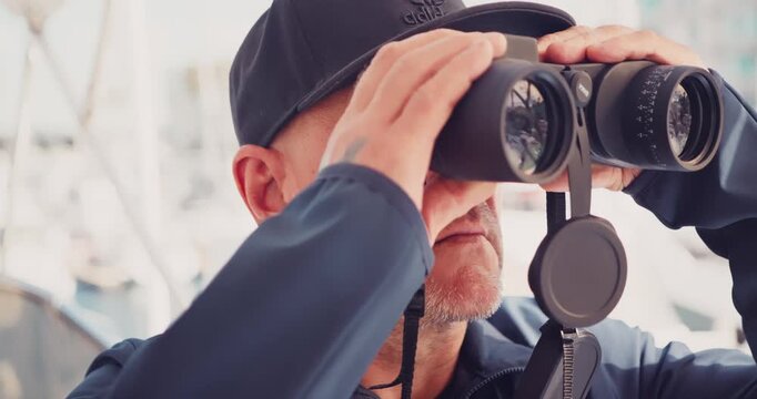 Man Observing with Binoculars at Marina