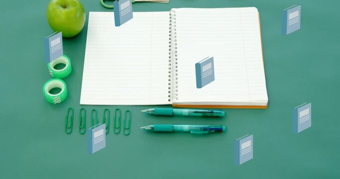 Animation of blue schoolbooks moving over notebook and school stationery on desk