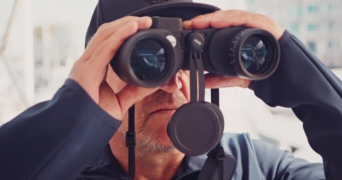 Man Observing with Binoculars Outdoors at a Marina