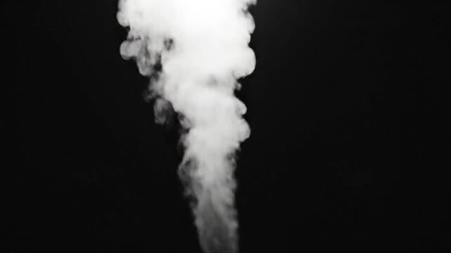 White smoke rising against a dark black background, dense fog and vapor creating abstract shapes and textures