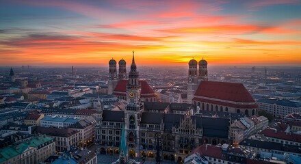Fototapeta premium Munich skyline at sunset with Frauenkirche and New Town Hall, Germany