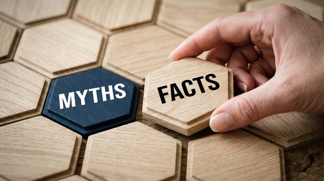 Fact vs. Myth: A hand carefully places a Facts tile next to a Myths tile, symbolizing the critical act of differentiating between truth and falsehoods.