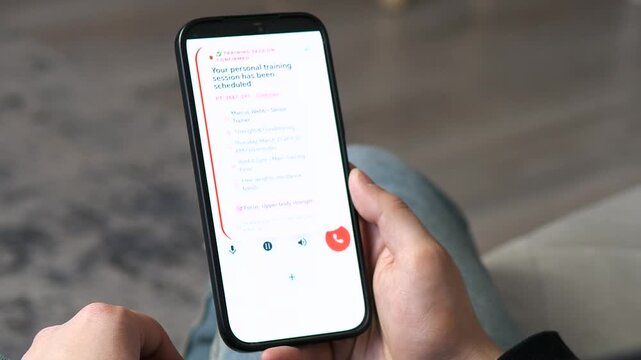 User confirms a personal training session at IronFit Gym via mobile app. Shows seamless scheduling and workout details. Perfect for fitness brands, health apps, and digital service promos. High