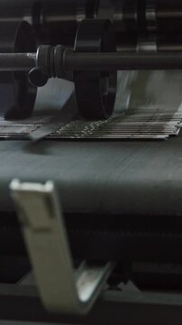 Printing Process on polygraph industry - brochures moving on the conveyor belt, slider