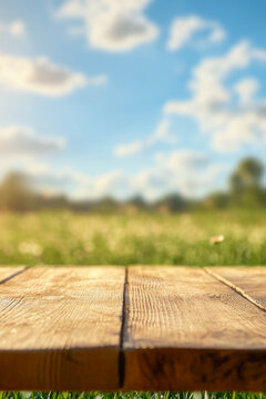 A wooden table sits alone in a vast open field, perfect for an impromptu picnic or meeting