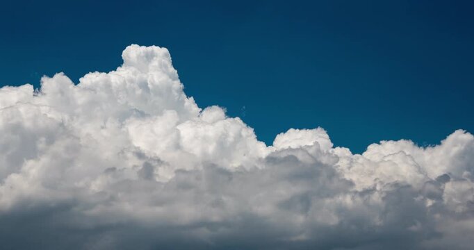 Timelapse of wall of clouds forming in the blue sky
