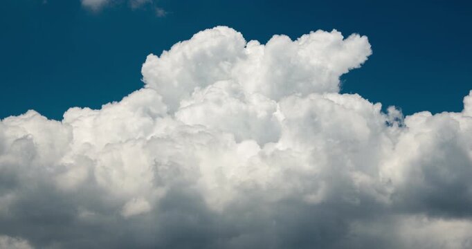 Timelapse of wall of clouds forming in the blue sky