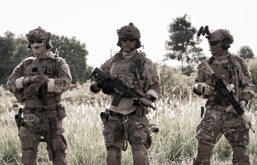 Fototapeta premium Military personnel in tactical gear on a mission-focused training exercise