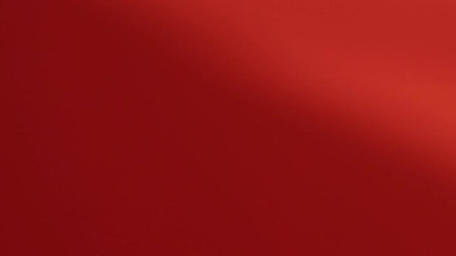 Una toma de cerca de un fondo abstracto de color rojo o anaranjado con negro un degradado ligero desenfocado en movimiento