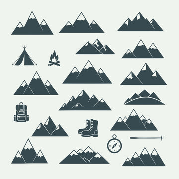Collection of various mountain silhouettes, including camping gear like tents, bonfires, hiking boots, and navigation tools like compasses and poles
