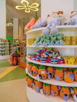 Belek, Turkey - March 30, 2026: Interior of Nickelodeon store featuring Spongebob's pineapple house plushies and character toys on circular shelves at The Land of Legends Theme Park