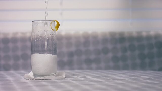 Serving of fizzy lemonade juice in a glass
